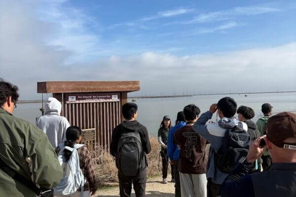 College students on a field trip learning about one of the salt ponds on the wildlife refuge.