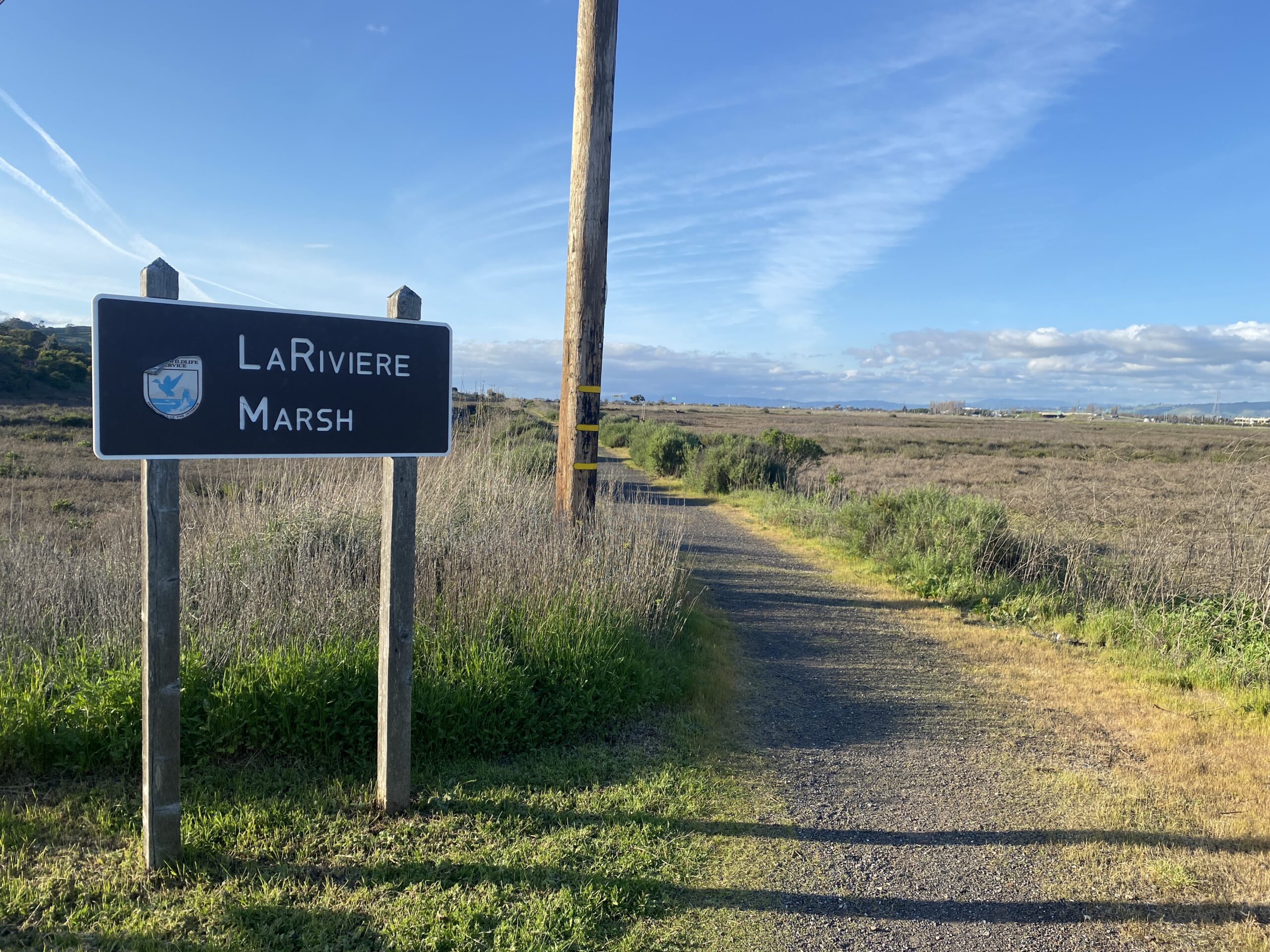 La Riviere Marsh trail and sign.