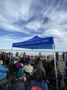 Partners and supporters gathered under Don Edwards SF Bay NWR canopy as Dave Halsing speaks.