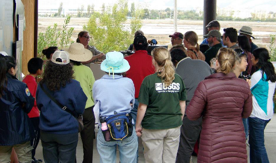 Debbie Sisson held the crowd mesmerized with the birds of prey that she brought from Sulphur Creek Nature Center. Image courtesy US Fish and Wildlife Service