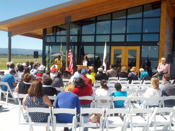 Members of the East Palo Alto community listen to Lisa Guthrie, former mayor. Photo courtesy John Woodell.